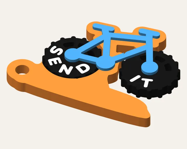Orange dirt-jump keychain with a blue mountain bike whose black wheels spin; the rear wheel says SEND and the front says IT.