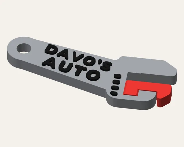 Grey adjustable spanner keychain with an angled head, a red sliding jaw, a black worm-screw and DAVO'S AUTO on the handle.