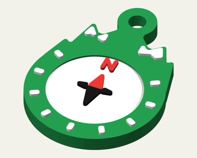 Green round keychain under snowy white peaks, with a white compass dial that spins and a red north needle.