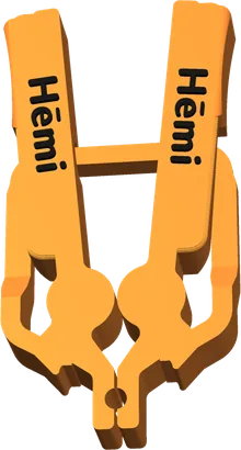 An orange peg with “Hēmi” in black letters on both legs